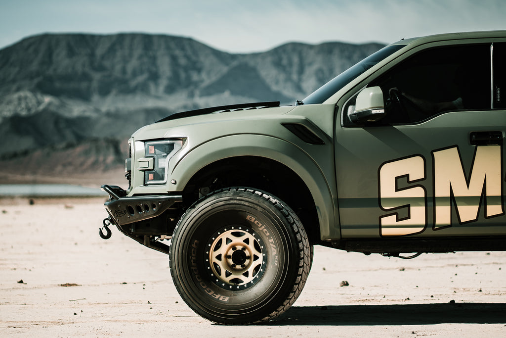 Green ford raptor with FiberWorkx 2017-2020 Ford Raptor Fenders - 2.5" Bulge installed side view