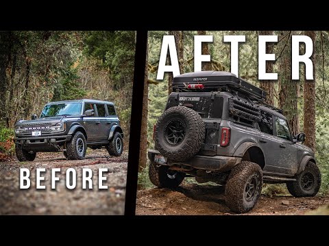 Two off-road vehicles in a forest setting are shown side by side, illustrating a modification before and after. The vehicle on the left is unmodified while the vehicle on the right is heavily modified for off-roading with larger tires, lifted suspension, and additional gear like a roof rack and spare tire mounted on the back.