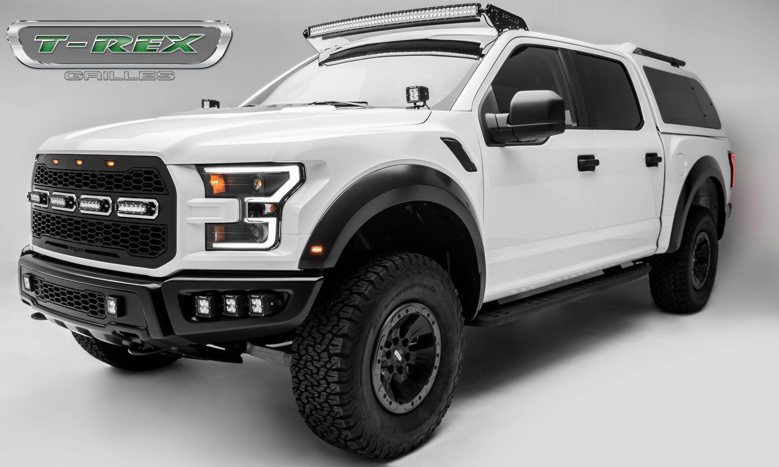 T-Rex Grille On a White Ford Raptor Side view angled